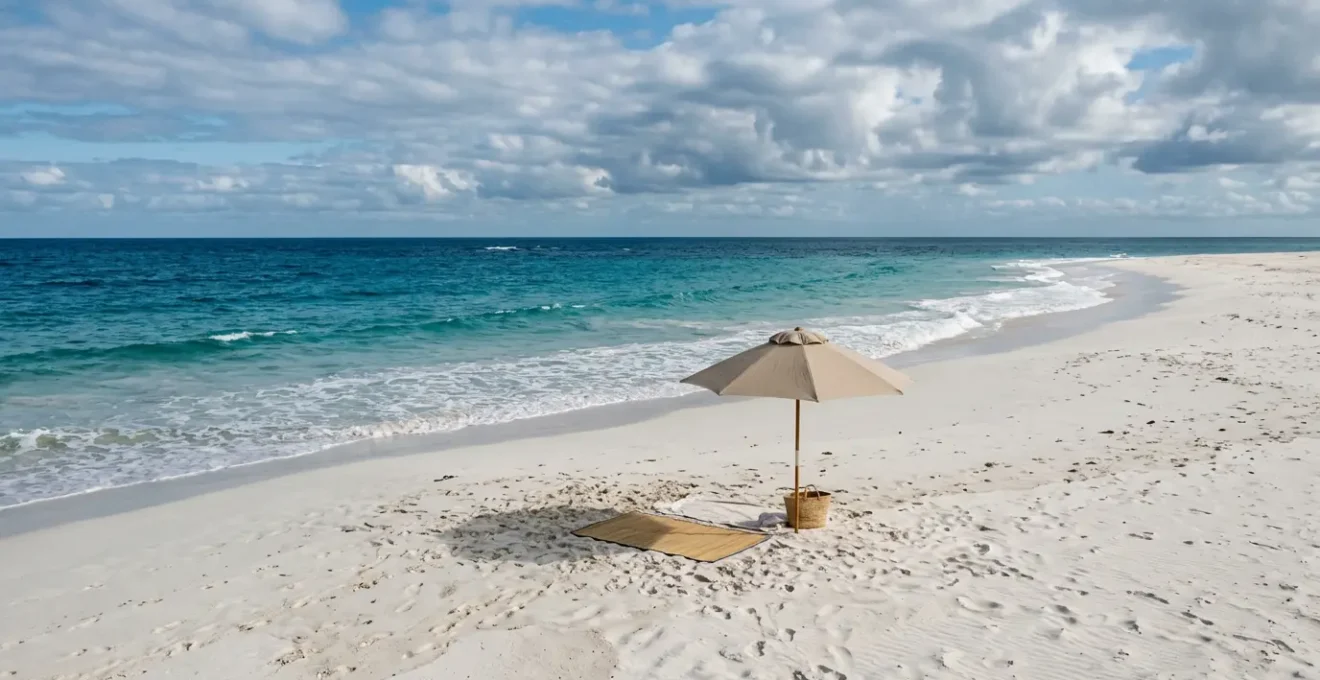 Sunlit beach scene with textured sand and natural sun protection elements