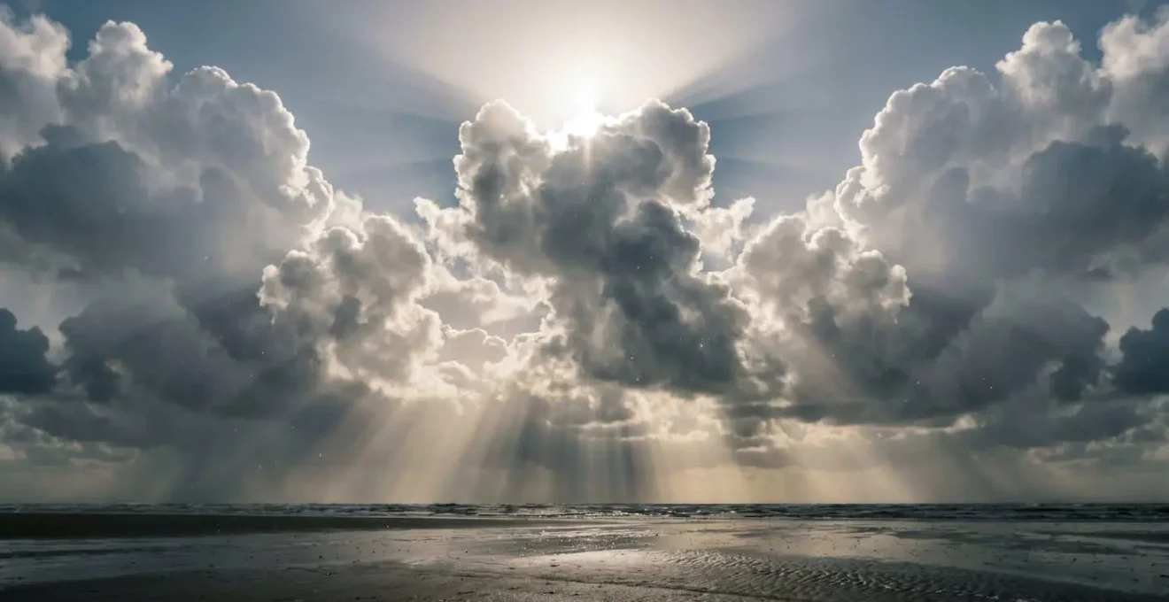 Diffused sunlight breaking through clouds over beach creating atmospheric lighting